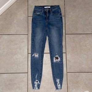 Medium wash skinny jeans with cheetah patches!